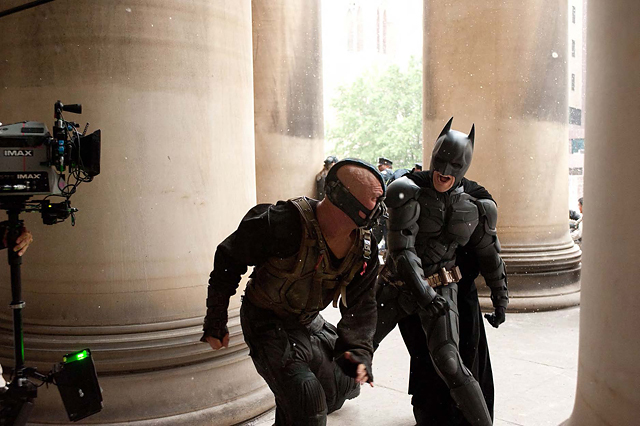 Batman (Christian Bale) throws a powerful blow at Bane (Tom Hardy) during principal photography in Pittsburgh. © Warner Bros. Entertainment Inc